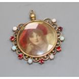 A Middle Eastern? yellow metal, white opal an red paste? set glazed circular pendant, overall