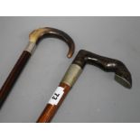 An Edwardian oak walking stick with pewter mounted horn horse hoof handle, 84cm and an ebony walking