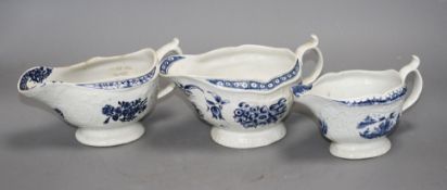 A Lowestoft blue and white sauceboat, c.1770 and two Worcester blue and white sauceboats, c.1758-65,