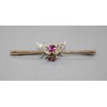 A Victorian 9ct, garnet and diamond set bug bar brooch, 54mm, gross weight 3.3 grams. Condition: