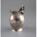 A George III engraved silver helmet shaped cream jug by George Burrows, London, 1799, height 11cm,