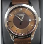 A gentleman's modern stainless steel Victorinox Swiss Army quartz wrist watch, with baton numerals