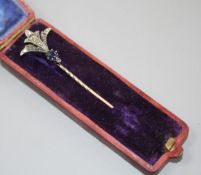 An early 20th century yellow and white metal, sapphire and diamond set stick pin, 62mm, gross weight