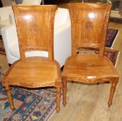 A pair of Asian hardwood hall chairs, with foliate carved frames, W.57cm D.52cm H.115cm Condition: