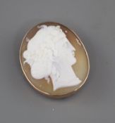 A yellow metal mounted oval cameo brooch, carved with the head of a lady to sinister, 40mm, gross