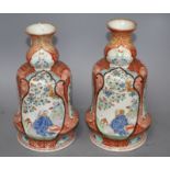 A pair of Japanese enamelled porcelain huqqa base vases, decorated with figures, height 25cm