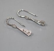 A pair of white metal and graduated diamond set fan-saped drop earrings, overall including ear