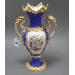 A Victorian porcelain vase, painted with panels of garden flowers, height 35cm Condition: Minor