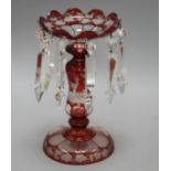 A late 19th century Bohemian ruby overlaid glass table lustre, with spear shaped drops and