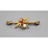 A late Victorian yellow metal ruby, cultured and seed pearl set bug brooch, 28mm, gross weight 1.6