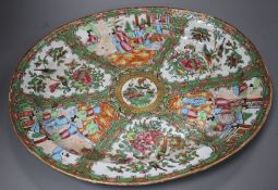 A 19th century Cantonese porcelain oval dish, decorated with panels of figures and birds, 42 x 34cm,