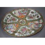 A 19th century Cantonese porcelain oval dish, decorated with panels of figures and birds, 42 x 34cm,