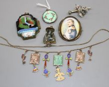 A white metal and enamel locket, a gilt metal and enamel necklace, two pendants, a brooch and 830