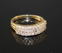 A modern 14k yellow metal and three row diamond set half hoop ring, size O, gross weight 4.3