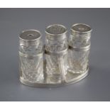A George III silver oval ink bottle stand, London, 1799 (no maker's mark), with three later