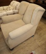 A 1930's wing armchair Condition: Frame solid, very heavy chair, upholstery now rather dirty and