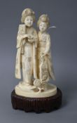 A Japanese Tokyo School carved ivory group of two geisha, late Meiji period, signed, height 18cm,