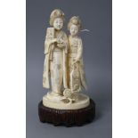 A Japanese Tokyo School carved ivory group of two geisha, late Meiji period, signed, height 18cm,