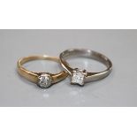A modern 18ct white gold and princess cut solitaire diamond ring and a 585 and solitaire diamond