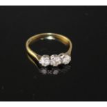 An 18ct and Plat, three stone diamond ring, size P, gross weight 1.8 grams, total diamond weight