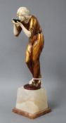 An Art Deco style resin figure of a lady, height 28cm Condition: Lacks one foot, hairline crack at