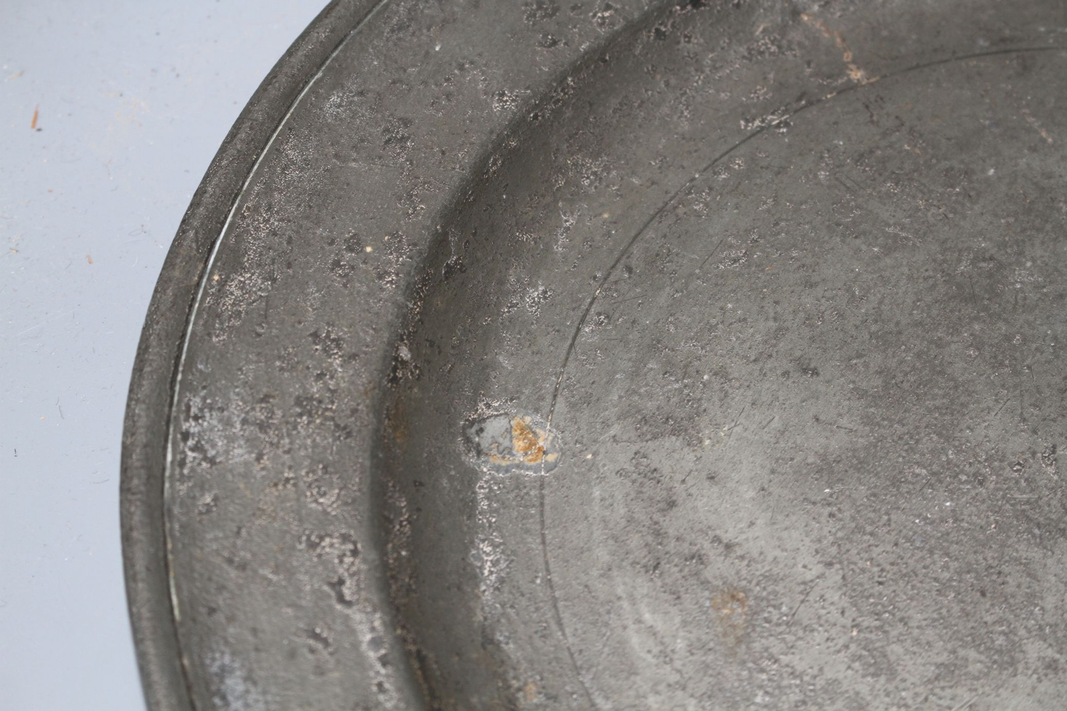 A George III pewter charger by William Hogg of Newcastle, diameter 34cm and a dished plate 27cm - Image 2 of 5