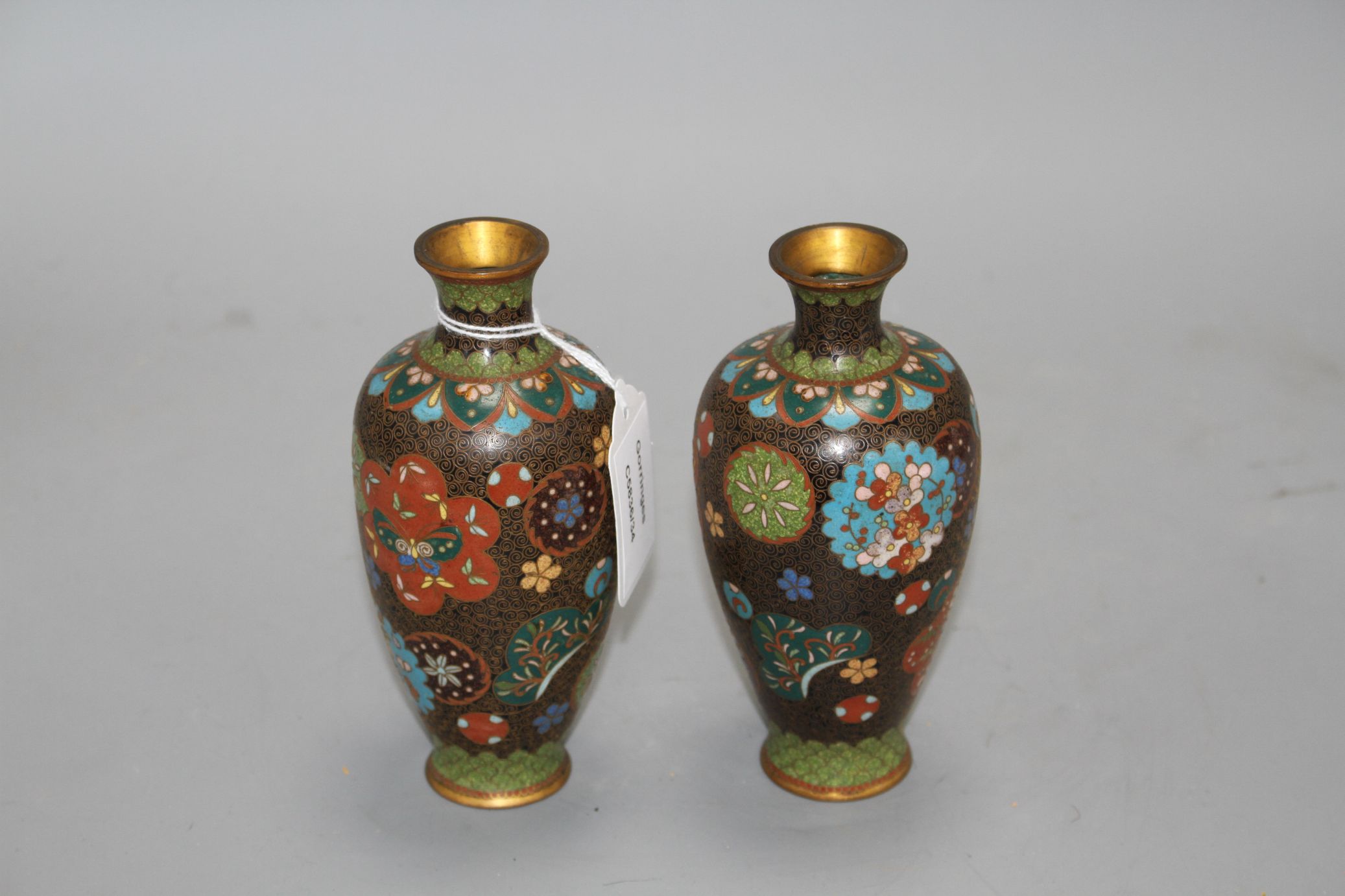 A pair of Japanese cloisonne vases, height 15cm Condition: Minor firing spots and wear to the - Image 2 of 4