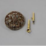 A Victorian pierced yellow metal and garnet set cluster brooch and two watch keys. Condition: Brooch