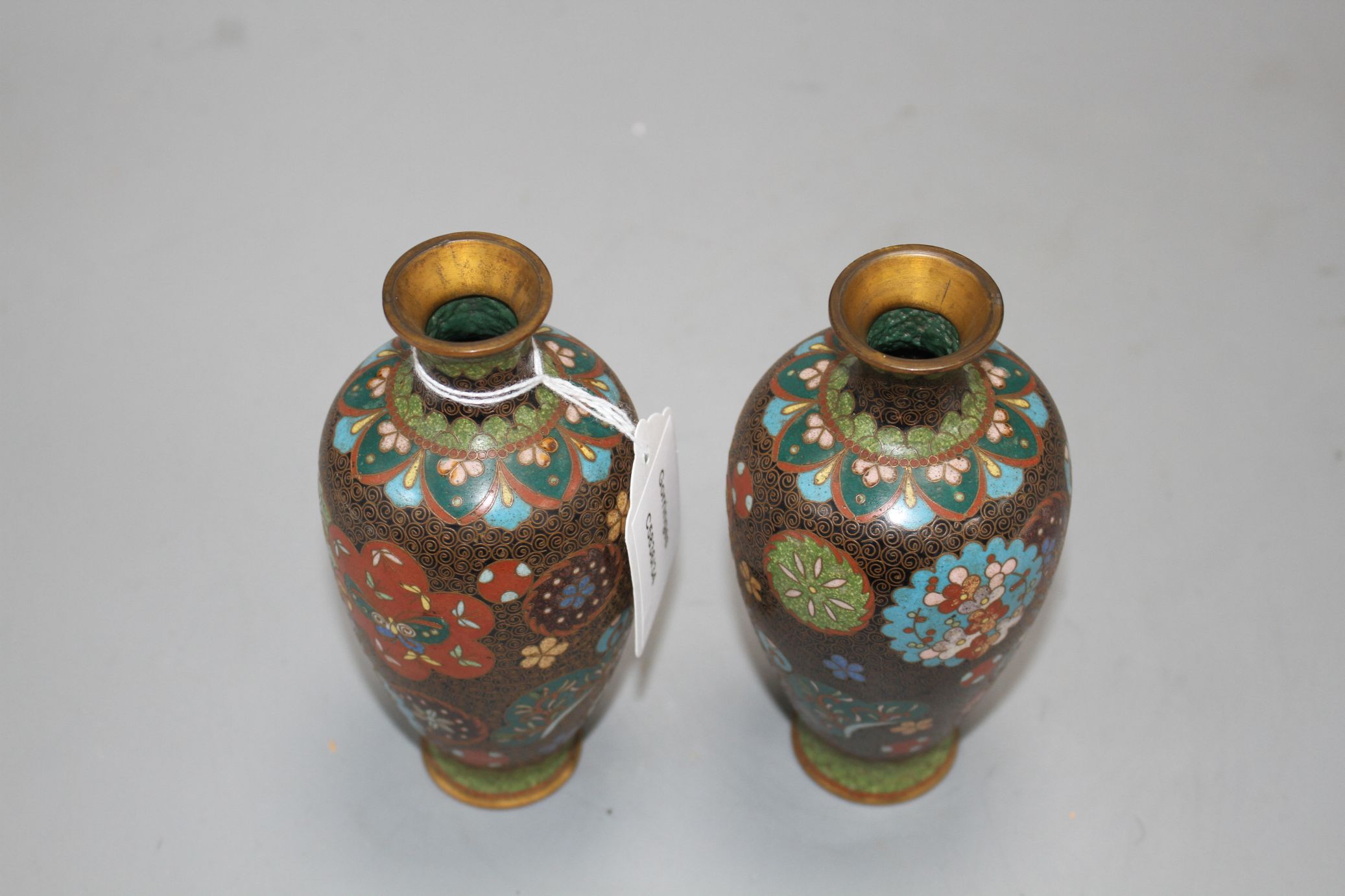 A pair of Japanese cloisonne vases, height 15cm Condition: Minor firing spots and wear to the - Image 3 of 4