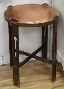 An Arts & Crafts circular copper top oak occasional table, Diam.52cm Condition: Top has been