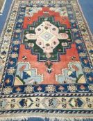 A Caucasian Kazak geometric rug, 295 x 175cm Condition: Possibly a little faded with patches of wear