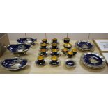 A Carltonware thirty five piece coffee and dessert service, with chinoiserie decoration on a dark