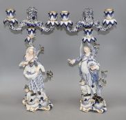 A pair of Meissen porcelain candelabra, modelled with lady and gallant stems, height 46cm Condition: