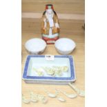 A Chinese blue and white reticulated plant stand, a Chinese figure of an immortal, twelve small