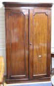 A Victorian mahogany two door wardrobe, W.126cm D.55cm H.201cm Condition: Overall of even rich mid