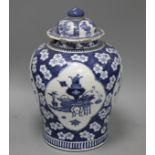 A 19th century Chinese blue and white jar, with panelled decoration, height 28cm and an associated