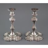 A pair of modern 18th century style Irish cast silver candlesticks, by Royal Irish Silver Co.