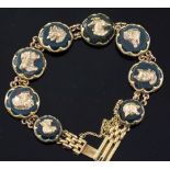 An early 20th century 9ct gold and bloodstone panel set bracelet, each stone mounted with a gold