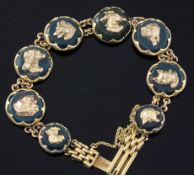 An early 20th century 9ct gold and bloodstone panel set bracelet, each stone mounted with a gold