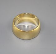 A 1970's 18ct gold wedding band, size M, 11.1 grams, Condition: Minor surface scratches in