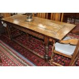 An oak refectory style dining table with cleated four-plank top, W.79cm L.210cm H.75cm Condition: