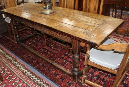 An oak refectory style dining table with cleated four-plank top, W.79cm L.210cm H.75cm Condition: