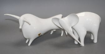A Royal Dux white glazed bull and an elephant, L. 26 and 21cm Condition: Loss to tip of bull's