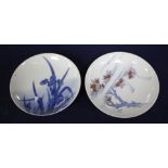 Two Japanese porcelain saucer dishes, decorated with irises and flowering trees, diameter 15.5cm