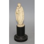 A 19th century Dieppe carved ivory figure of St Joseph holding the Christ child, 16cm