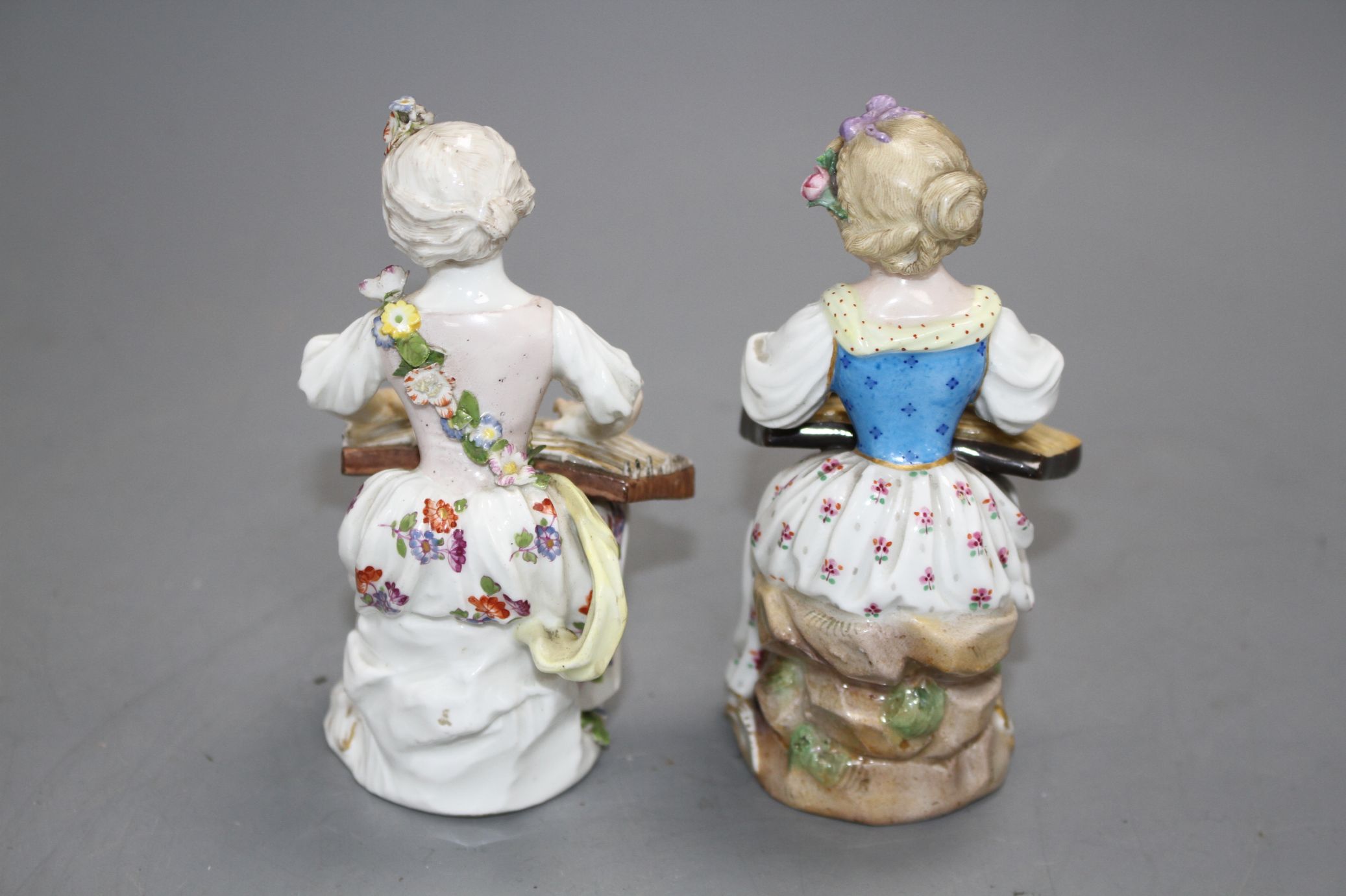 An 18th century Meissen figure of a girl playing a zither and a 19th century Meissen figure of a - Image 5 of 6