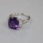 A white metal, amethyst and six stone diamond set dress ring, size R/S, gross weight 6.2 grams.