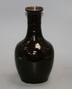 A Chinese dark brown glazed baluster vase, height 31cm Condition: Firing flaws particularly one