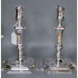A pair of modern 18th century design cast silver candlesticks by C.J. Vander Ltd, Sheffield, 1996,