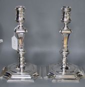 A pair of modern 18th century design cast silver candlesticks by C.J. Vander Ltd, Sheffield, 1996,